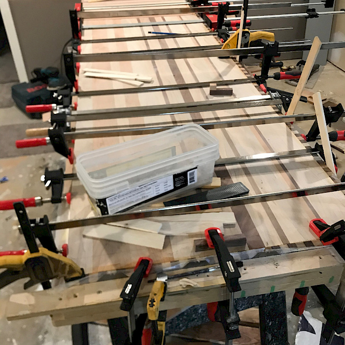 Custom laminated hardwood board with walnut and maple by Sparrow Contracting