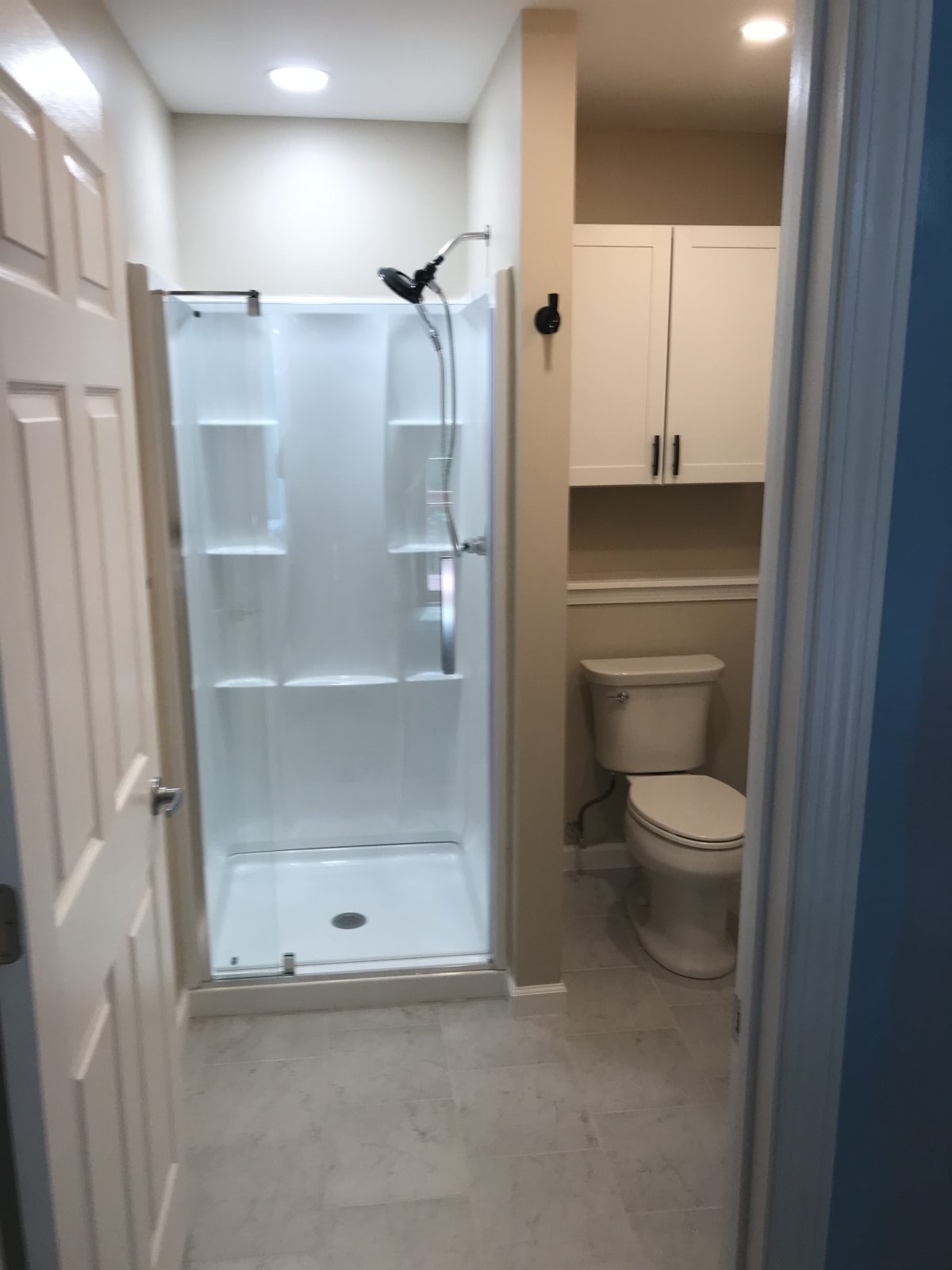 Bathroom remodel with custom shower stall and cabinetry