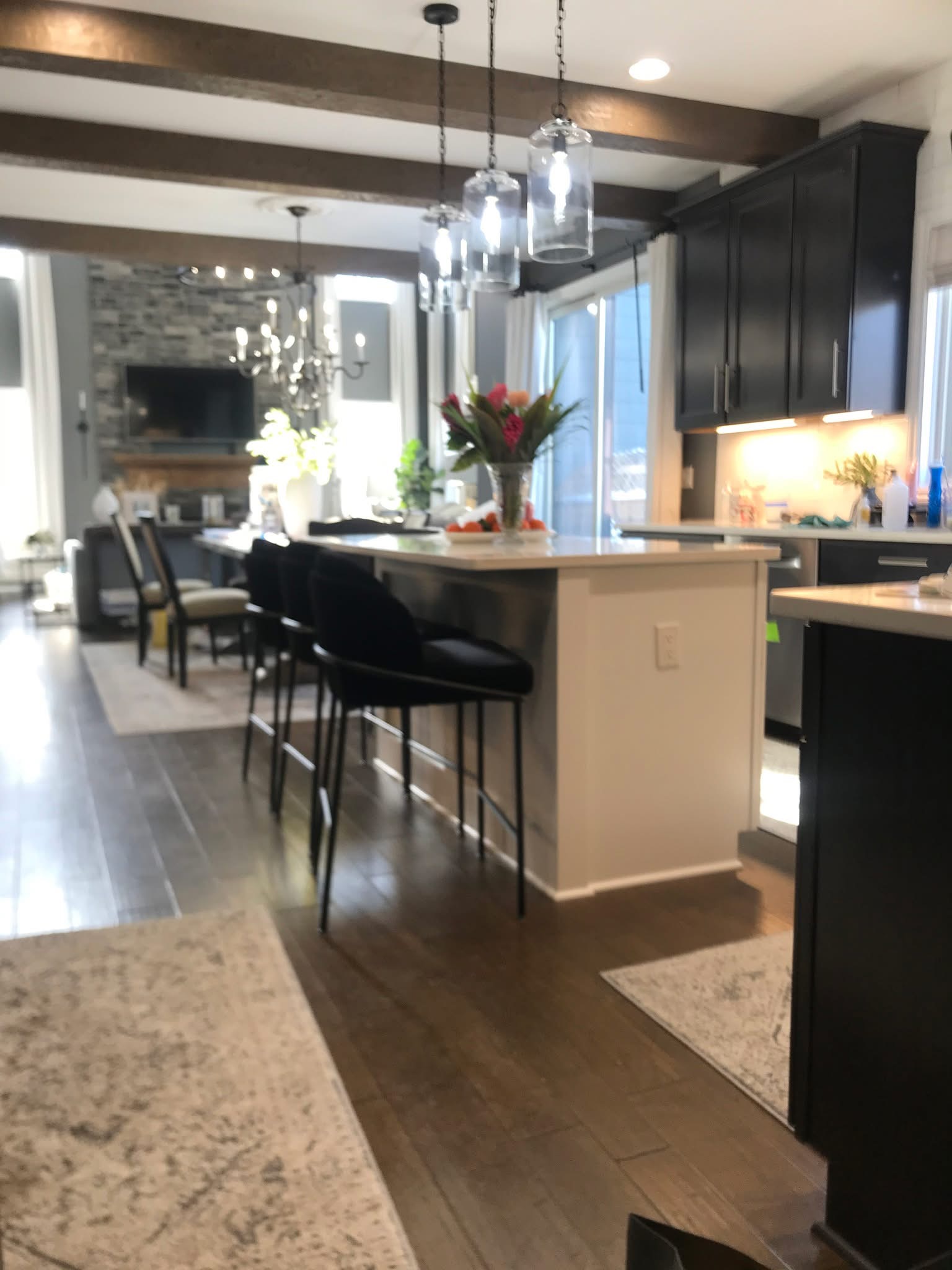 Kitchen remodel with island and pendant lighting by Sparrow Contracting in Brighton, Michigan